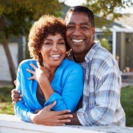 Couple in front of house